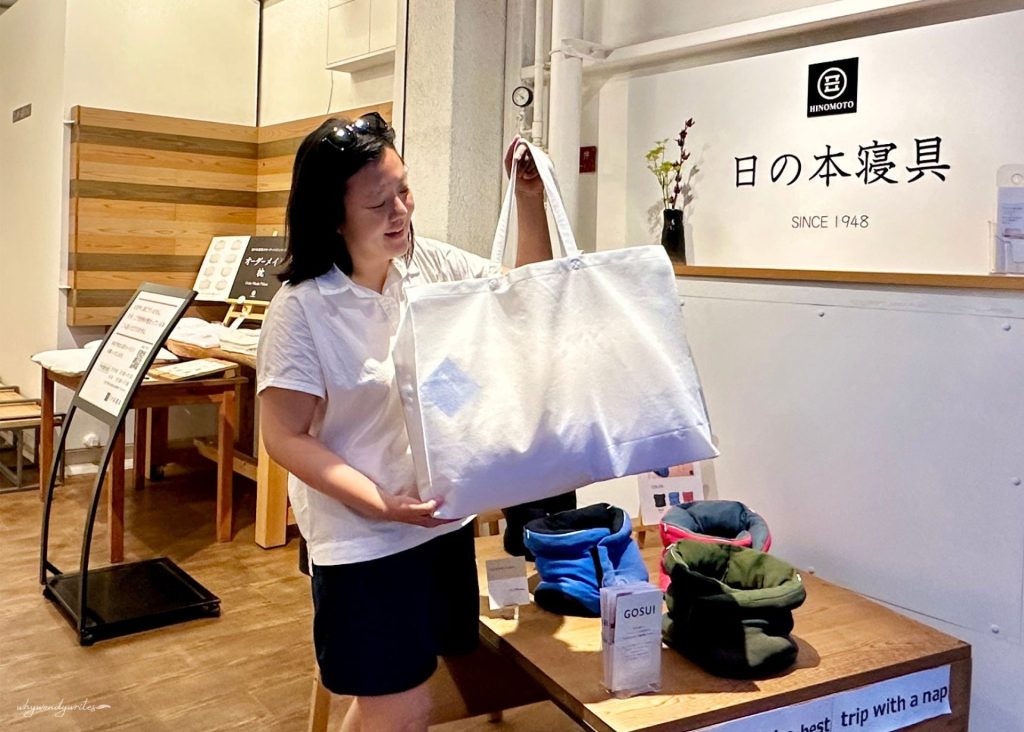 whywendywrites Wendy at Hinomoto Shingu storefront holding her custom made pillow